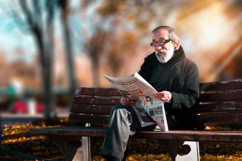 Man reading newspapers